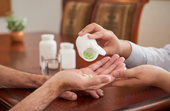 Doctor giving medicine to patient
