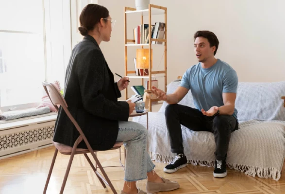 Therapist counseling patient during psychological therapy session