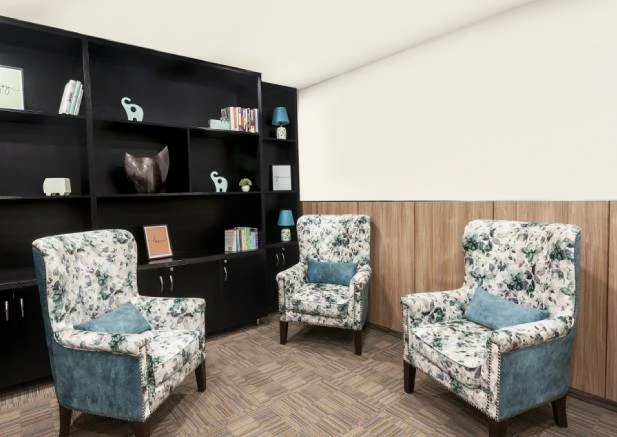 Doctor consulting patient in modern medical clinic setting