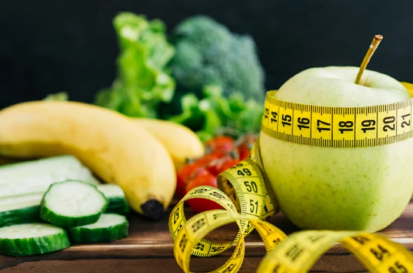 Healthy diet foods arranged on a wooden table background