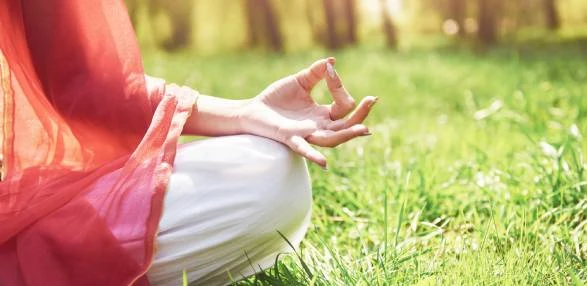 Woman meditating for mental wellness and stress relief